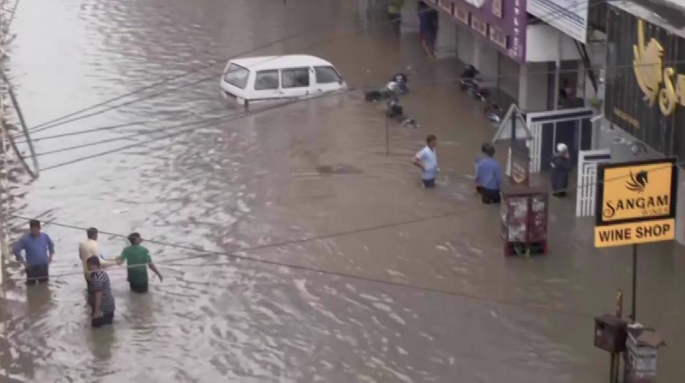 Residents wade through floodwaters in India's Nagpur
