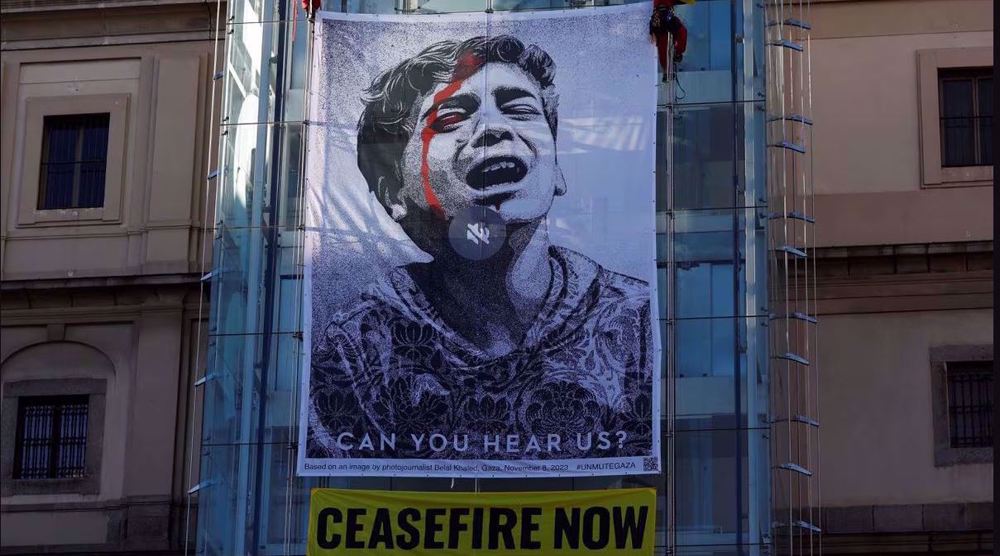 Activists unveil giant banner in Madrid to demand ceasefire in Gaza