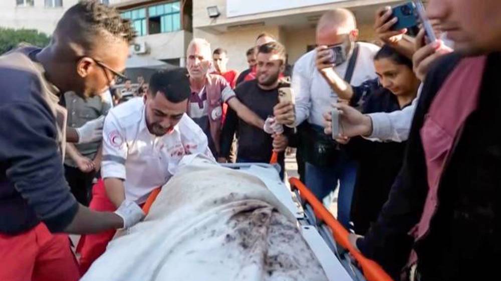 Gazan ambulance worker finds himself carrying own mother’s body killed in Israeli raid