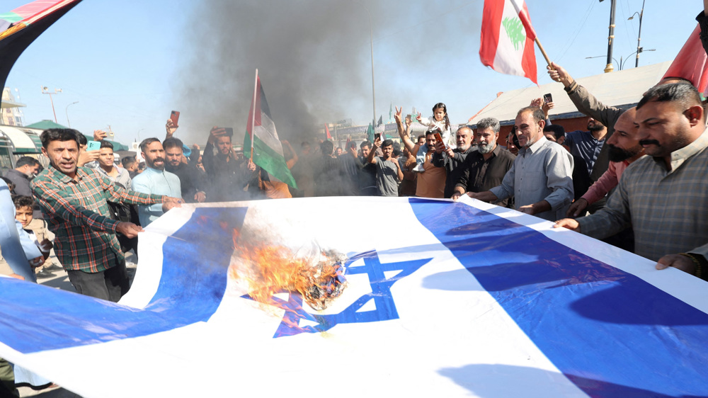 Outraged over Gaza genocide, Iraqi protesters burn Israel, US and UK flags