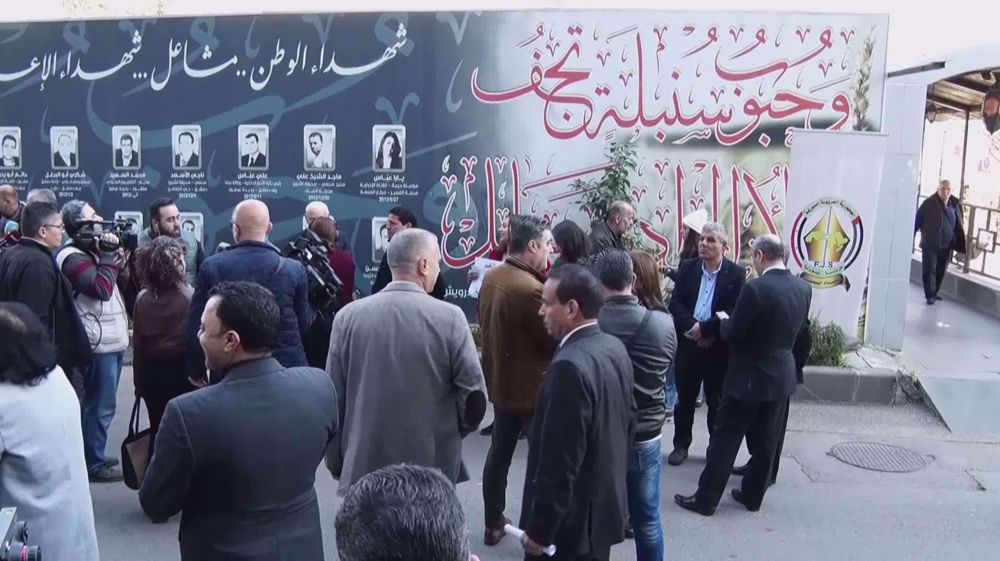Syrian union of journalists organizes solidarity stand with Palestinian journalists in Gaza