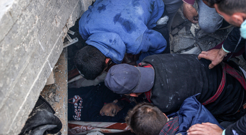 Gazans inspect rubble, pull dead boy after Israeli strike on Rafah