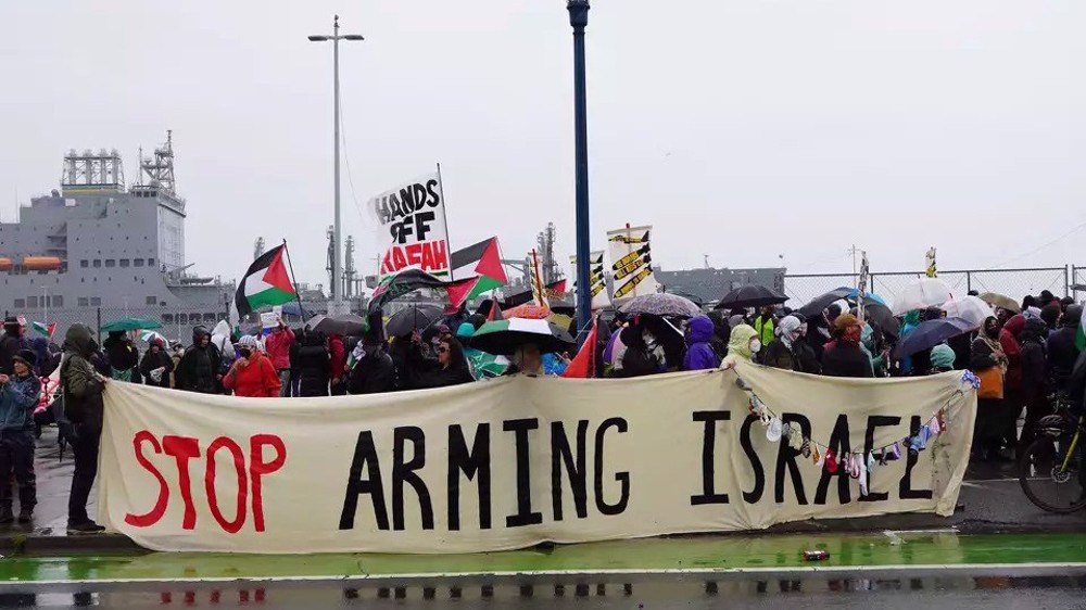 Pro-Palestine protesters chain themselves to US warship heading to Gaza