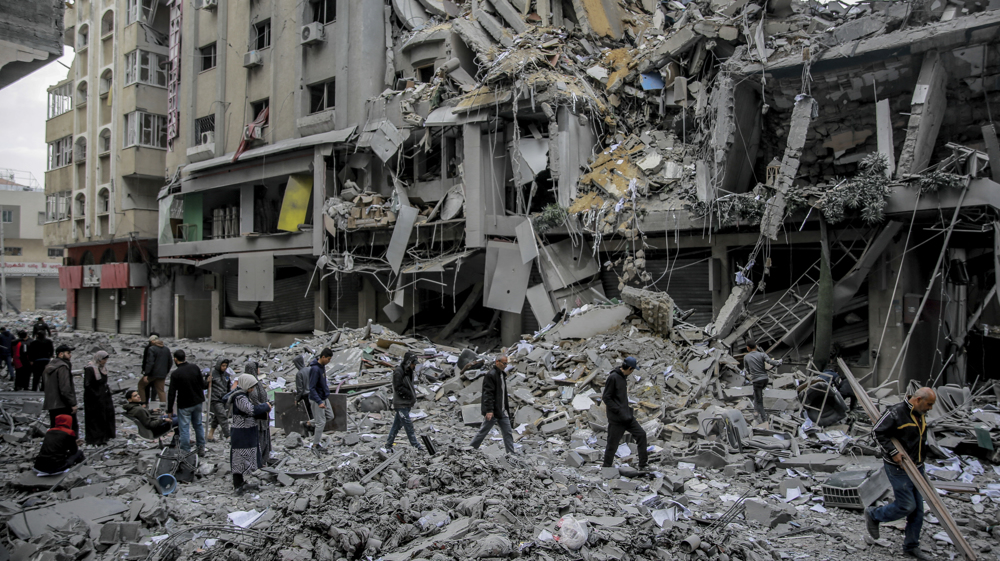 Palestinians search through rubble following Israeli strike on Rafah