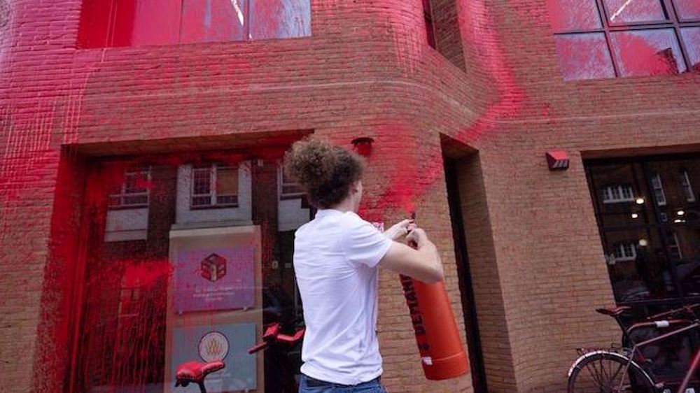 Pro-Palestine activists paint UK Labour Party office red