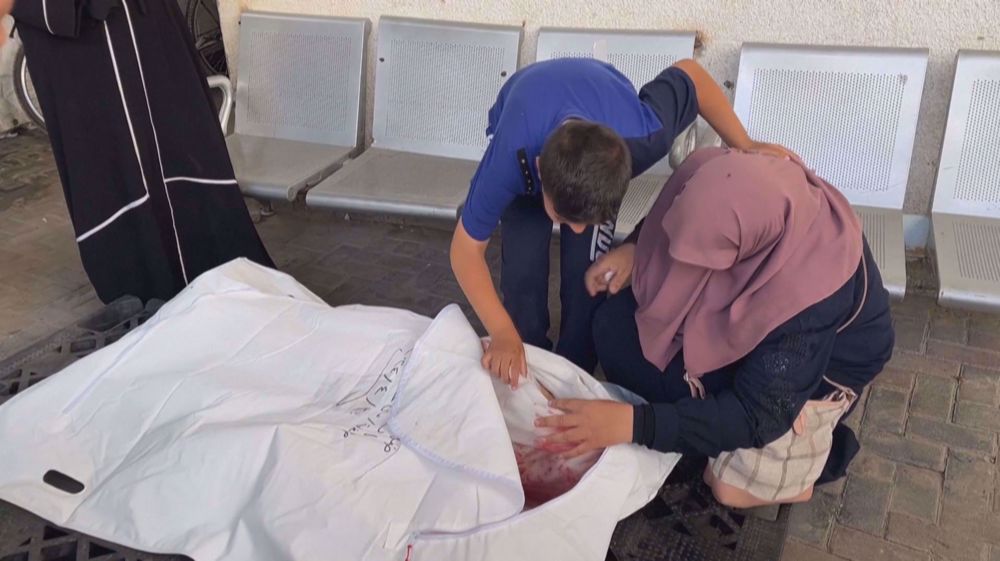 Gazans mourn over bodies of loved ones at al-Najjar hospital in Rafah