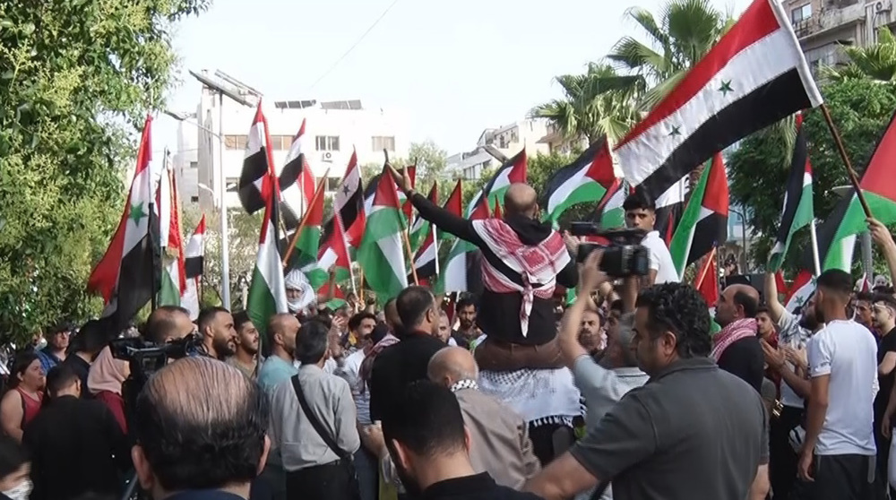 Syrian, Palestinian youth stage rally in Damascus in solidarity with Gaza