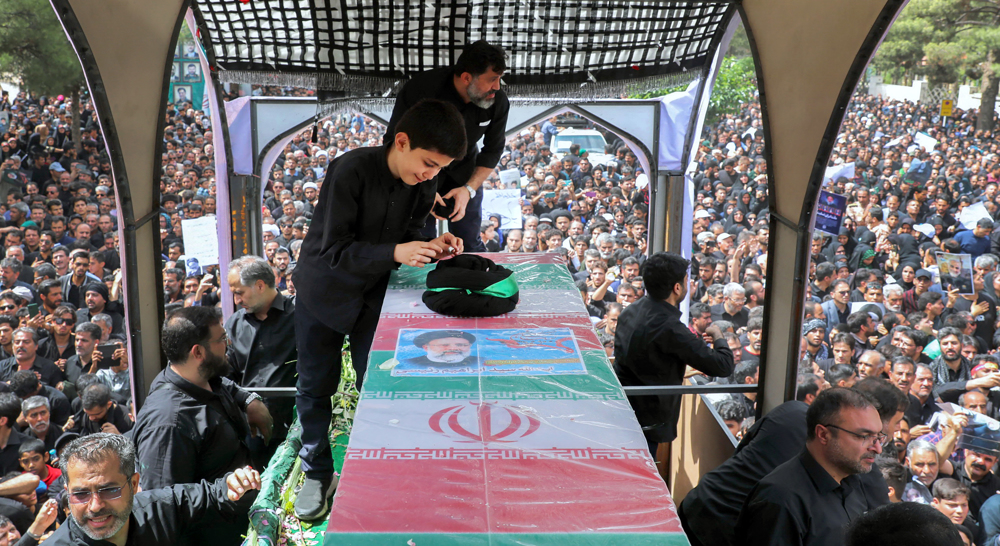 Iran bids farewell to popular president