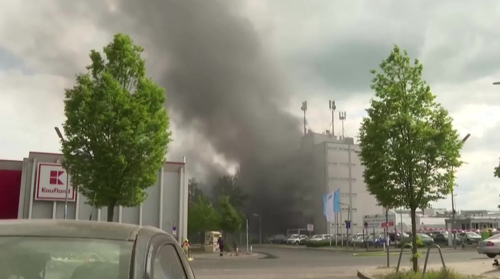 Smoke clouds billow over Berlin after fire at factory with chemicals storage