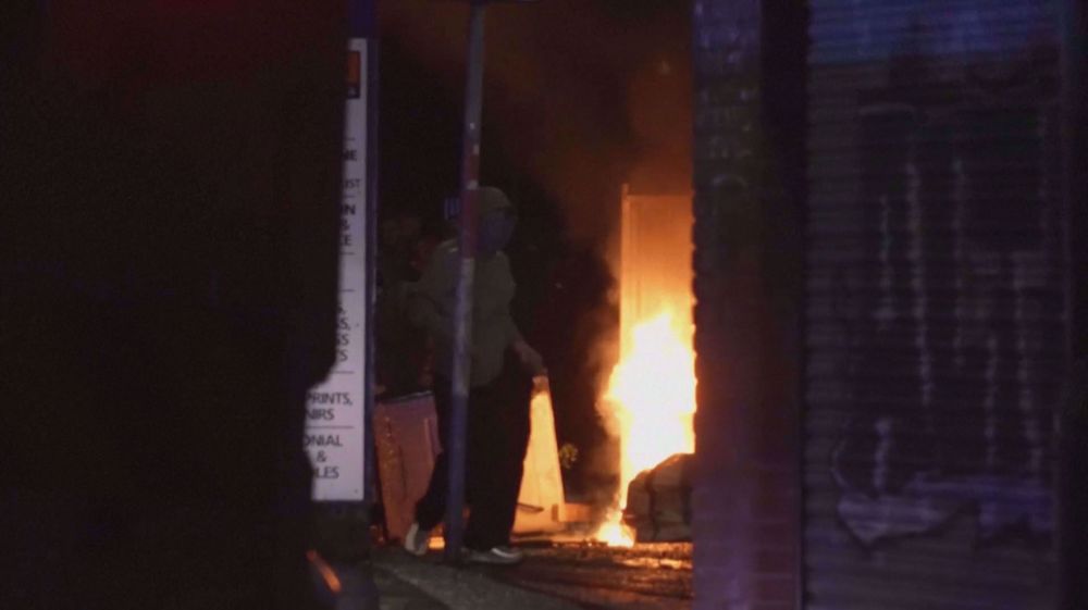 Fires burn in Belfast streets as UK riots intensify