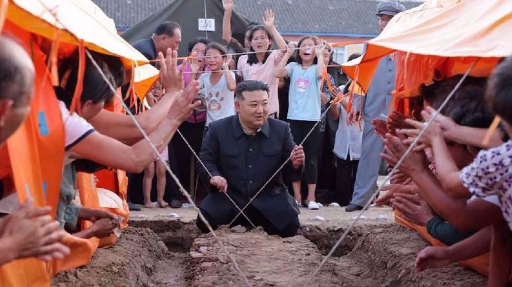 North Korean leader revisits flooded area, plans to relocate 15,400 people to capital 