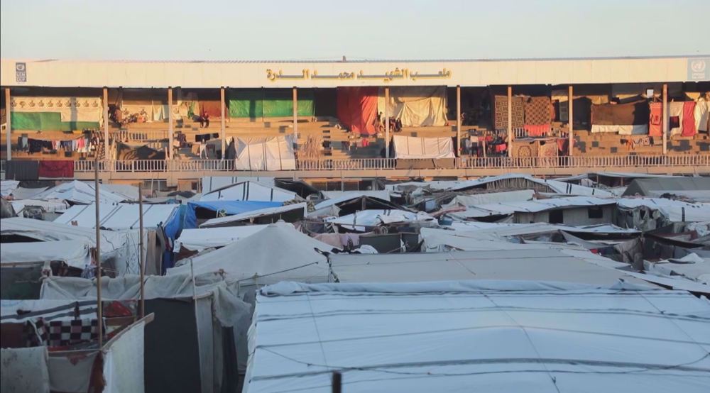 Displaced Gazans taking refuge in stadium under rains