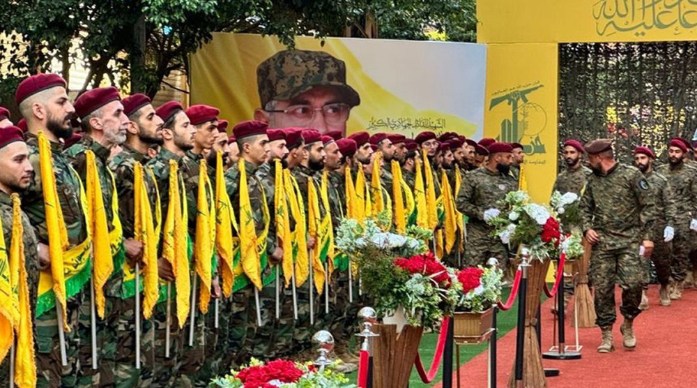 Hezbollah, supporters hold mass funeral for slain commander