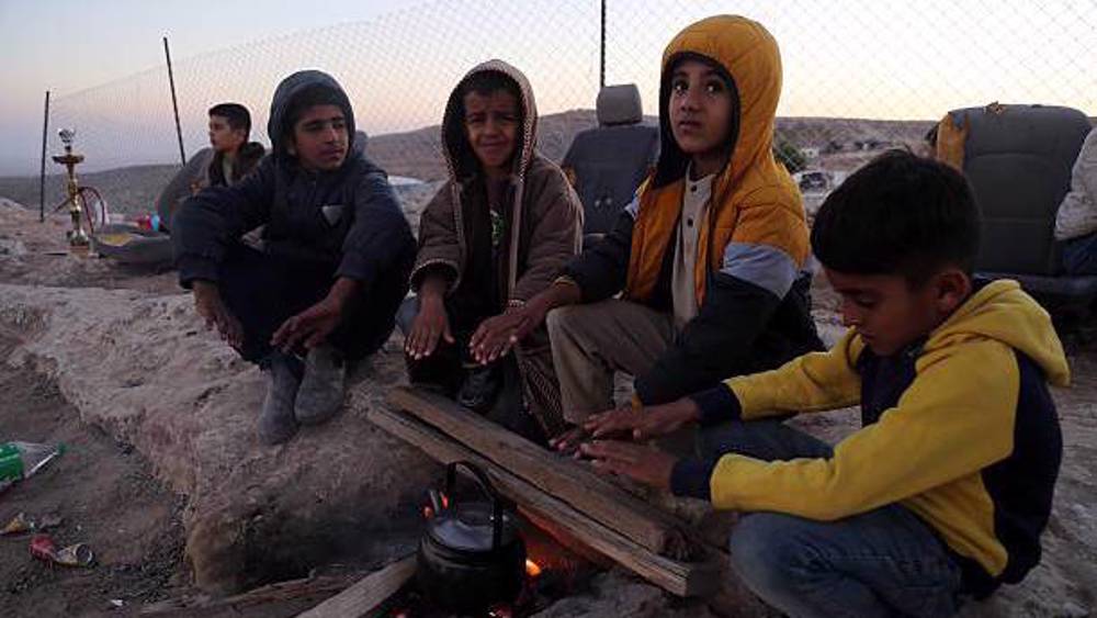 Palestinian family forced to live in the open after settlers occupy their cave shelter