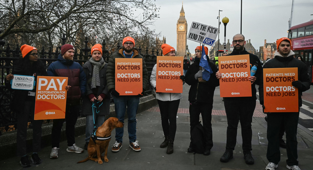Doctors in England begin 5-day strike over pay standoff amid flu surge