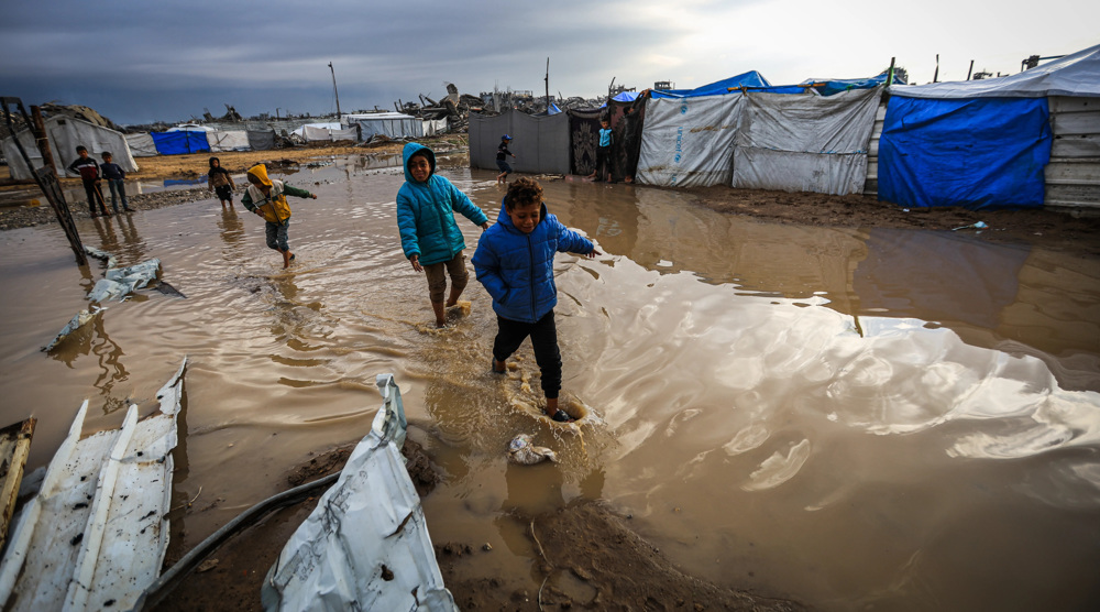 Displaced Palestinians freeze in flooded tents as Israel continues Gaza truce violations