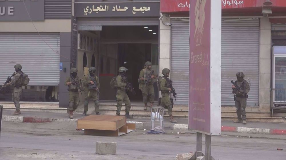 Israeli forces raid foreign exchange centers in occupied West Bank