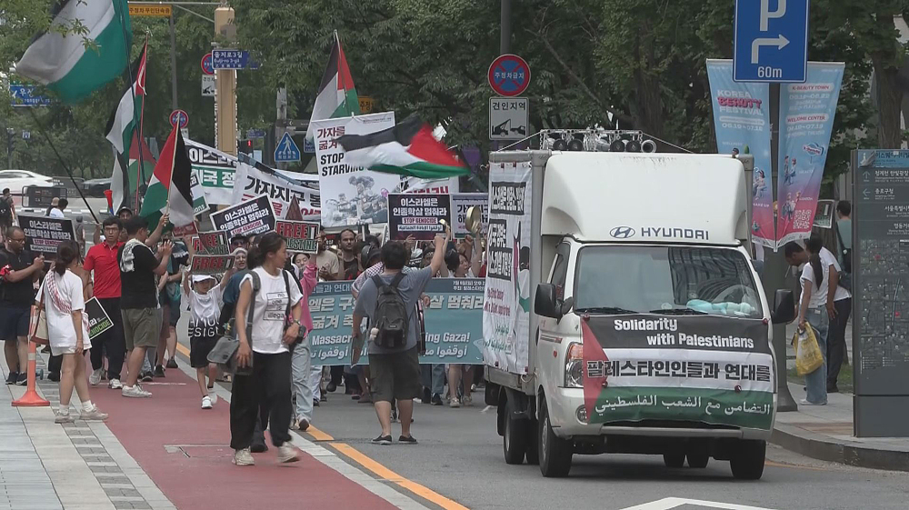 South Koreans decry corporate nexus with the economy of genocide