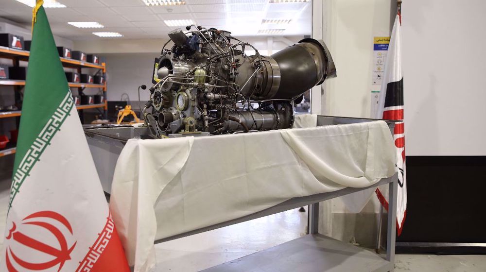 Iranian technicians overhaul engine of BK 117 helicopter