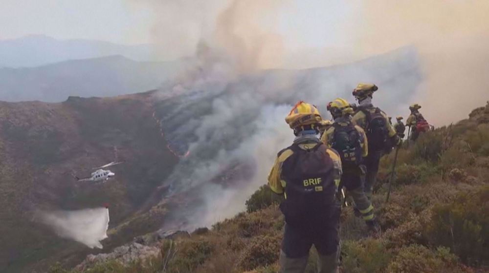 Spanish firefighters continue battling wildfires in northwest Spain