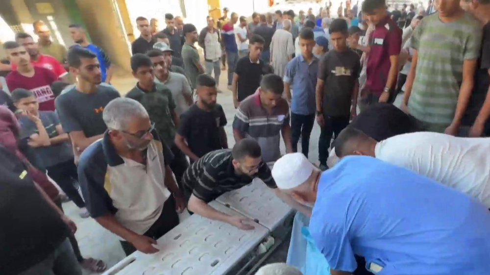 Palestinians mourn couple killed in Israeli strike on central Gaza