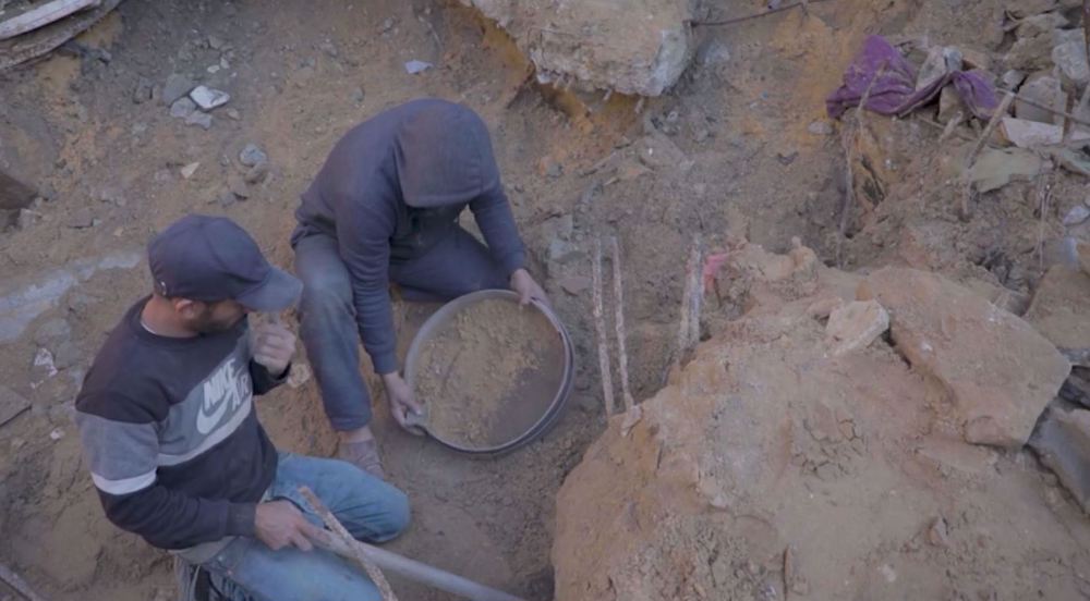 A silent grief: Palestinian man struggles to recover remains of wife, children
