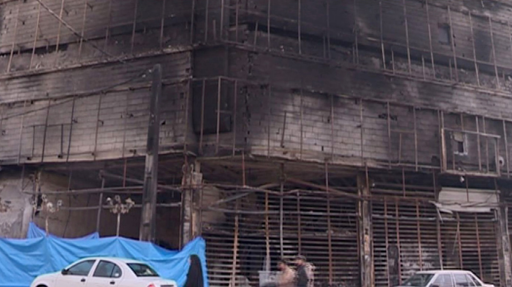 Store, gym set on fire by masked rioters during recent unrest in Tehran