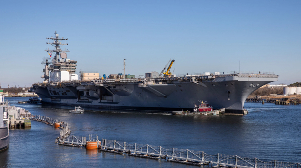 Second carrier burns as US fleet crumbles under grind of Iran war