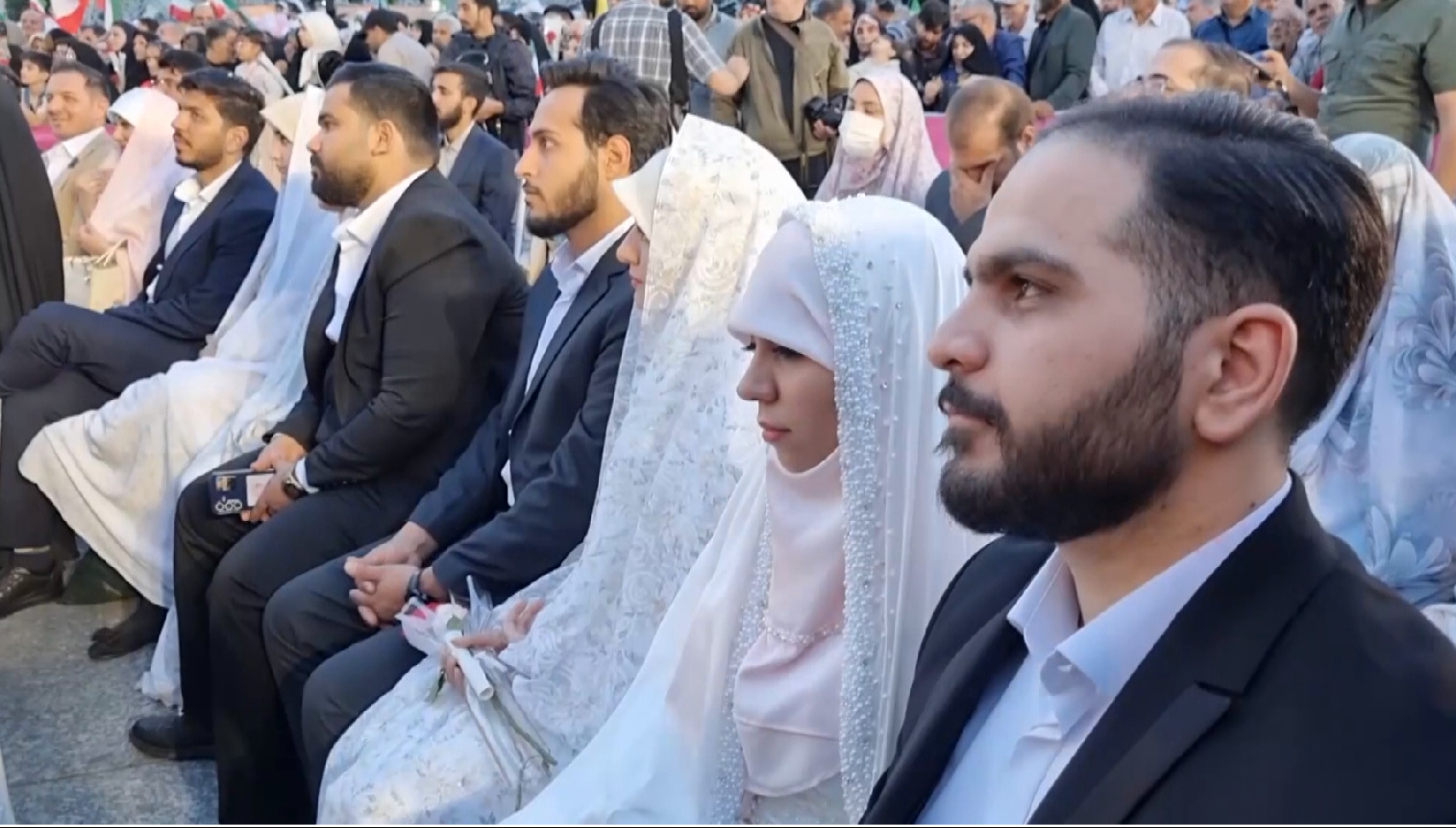 Iranian couples hold mass wedding in Tehran amid war
