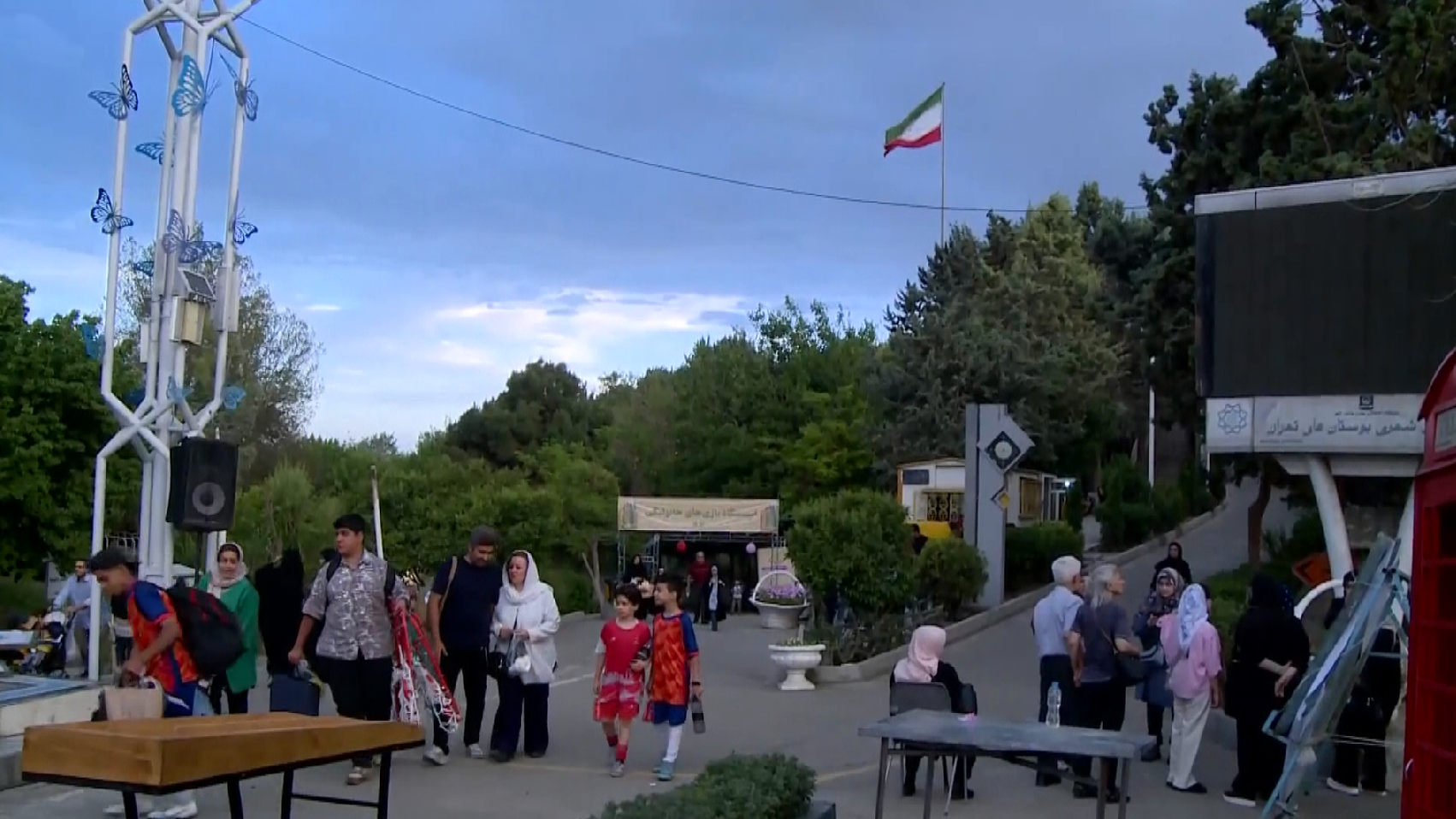 Life continues in Tehran as families flock to parks   