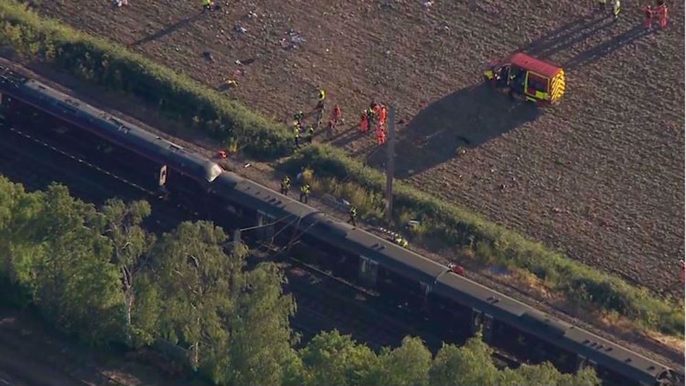 Driver killed and dozens injured in train crash north of London: Police