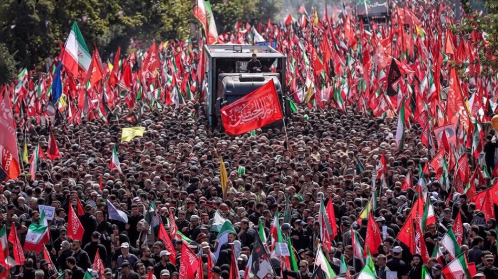 Martyred Leader’s coffin carried through Tehran's streets during funeral procession