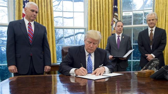 Trump signs order to scrap TPP trade deal 