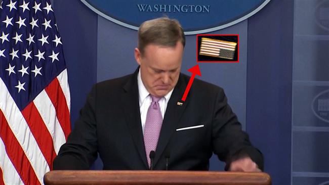 Spicer mocked for wearing US flag pin upside down