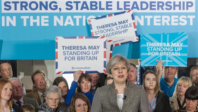 May's party ahead in poll despite slight decline