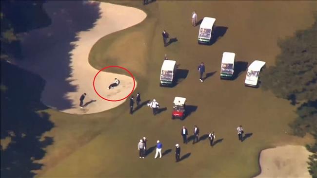 Japan PM falls into bunker while golfing with Trump