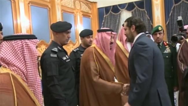 Watch: Grim Hariri stands in queue to salute Saudi king