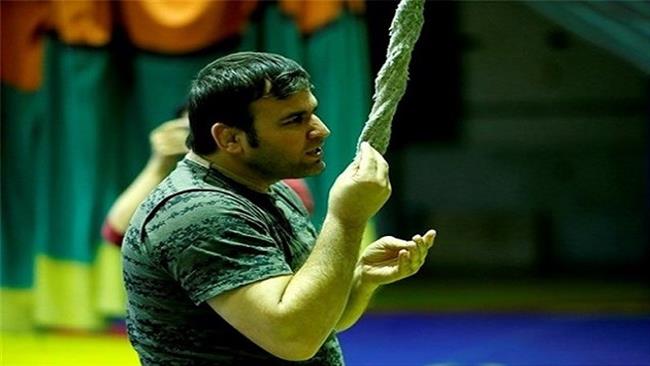 Iranian Olympian auctions silver medal for quake victims 