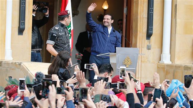 Hariri tells supporters he will stay in Lebanon