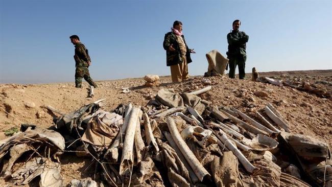 Iraqi forces unearth another Izadi mass grave 