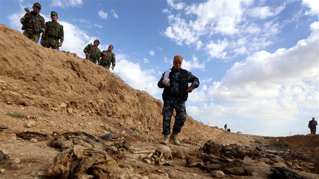 Hashd al-Sha’abi fighters find 2 Izadi mass graves