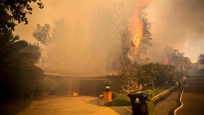 Wildfires continue to burn near Los Angeles