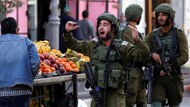Israeli commander caught on film pinching apples