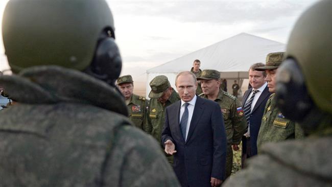 Putin orders withdrawal of troops on visit to Syria 