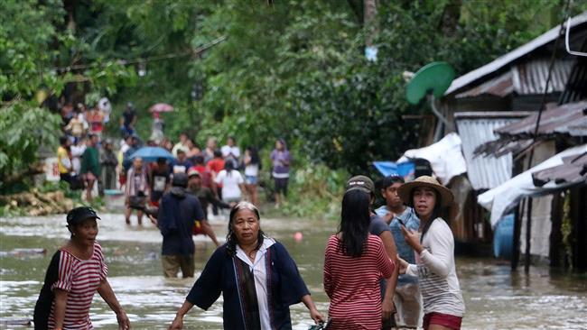 Three dead, thousands flee as storm hits Philippines