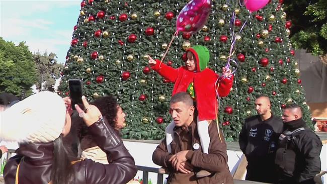 Despite Israeli policies, Palestinians celebrate Christmas