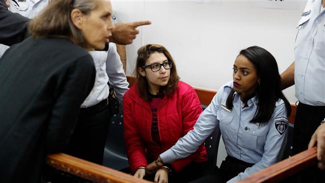 Israel charges Palestinian woman over slapping of troops