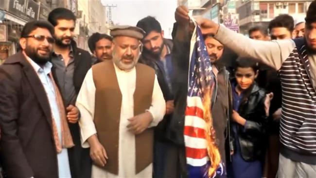 Pakistanis burn US flag at anti-Trump rally