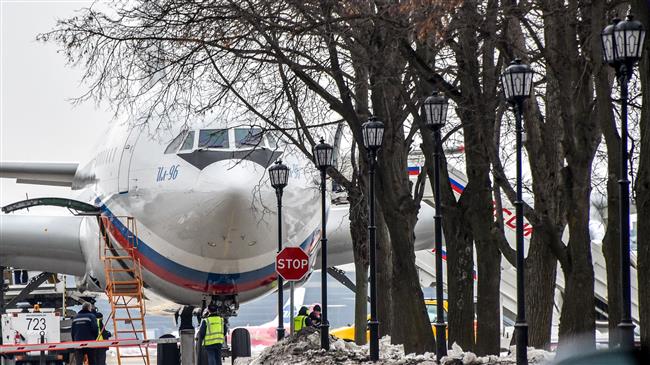 Russians expelled from US arrive in Moscow