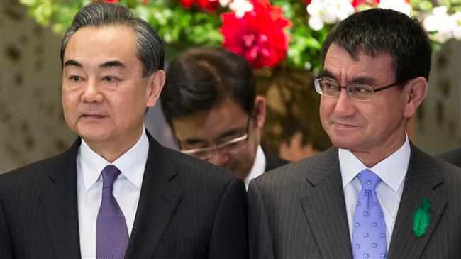 Japan, China warn trade war could harm global economy